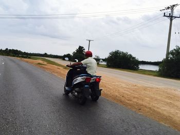 Person riding bicycle on road