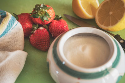 Close-up of strawberry and fruits on table