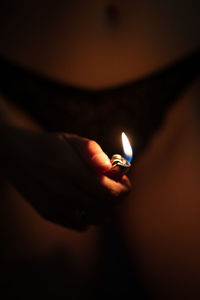 Close-up of hand holding cigarette lighter