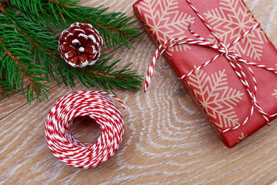 Close-up of christmas tree and gifts on table