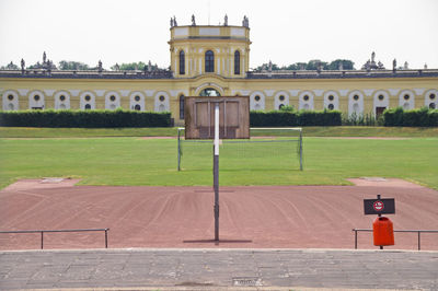 Playing field against historic building