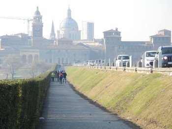 People walking on road in city