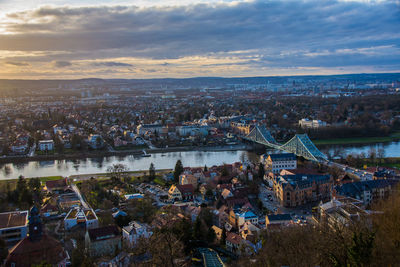 High angle view of illuminated cityscape against sky