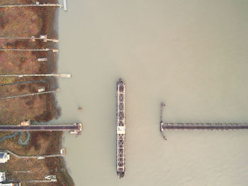 Aerial view of incomplete bridge over river