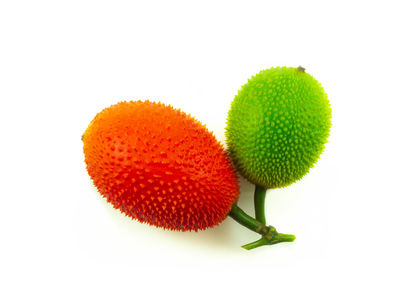 Close-up of fruit on white background