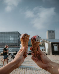 Cropped hand of person holding ice cream cone