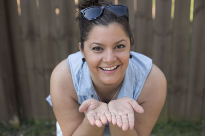 Close-up portrait of smiling young woman