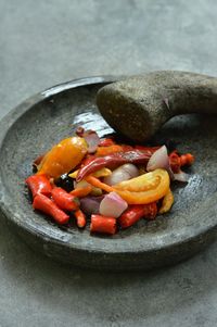 Ingredients for making chili sambal on the stone grinder 