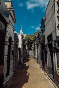 Street amidst buildings against sky