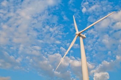 Low angle view of windmill against sky