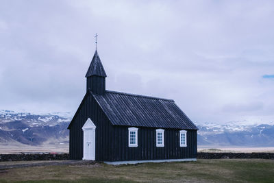 Church on field against sky