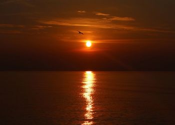 Scenic view of sea at sunset