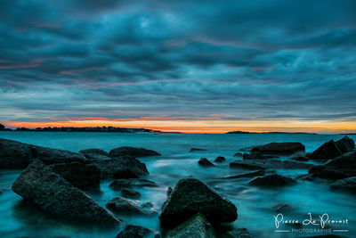 Scenic view of sea against cloudy sky