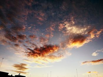 Low angle view of silhouette trees against sky during sunset