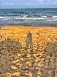 Shadow of man on beach