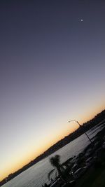 Scenic view of sea against clear sky during sunset