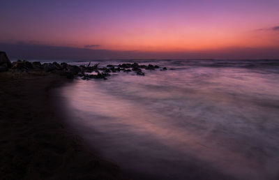 Idyllic view of sea against sky during sunset