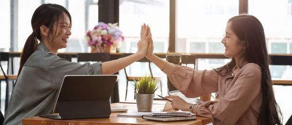 Woman using laptop on table