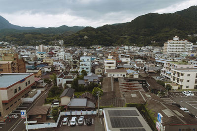 High angle view of townscape against sky. beppu, japan
