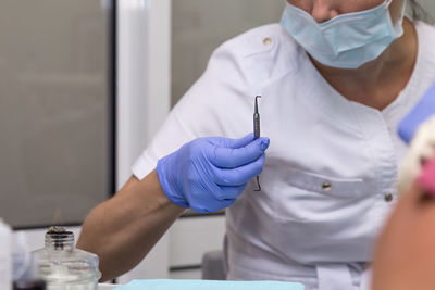 Midsection of female nurse working in hospital