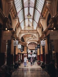 Group of people walking in building