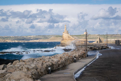 Scenic view of beach against sky