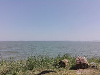 Scenic view of sea against clear sky
