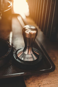 Close-up of illuminated lighting equipment on table