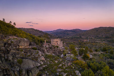 Drone aerial panorama of termas radium hotel serra da pena at sunset in sortelha, portugal