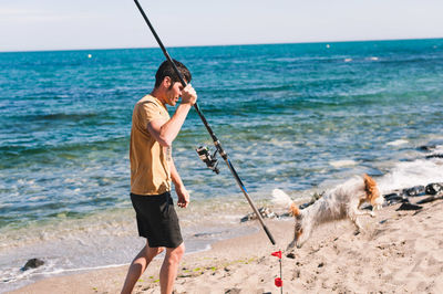 Full length of man standing on beach