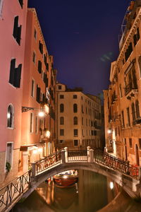 View of buildings in city at night