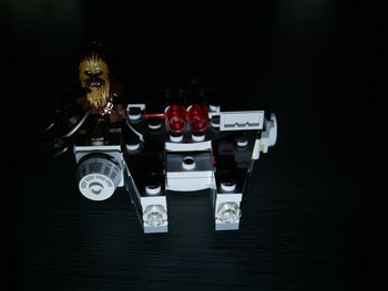 High angle view of toys on table against black background