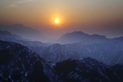 Scenic view of mountains against sky during sunset