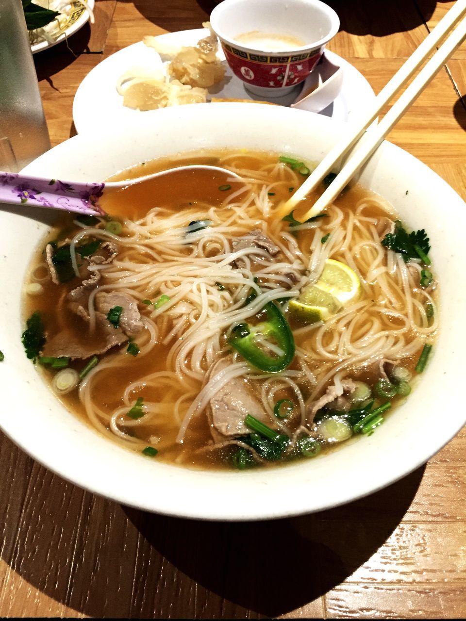 food and drink, indoors, food, freshness, bowl, table, ready-to-eat, meal, healthy eating, soup, serving size, noodles, plate, still life, high angle view, spoon, close-up, chopsticks, meat, healthy lifestyle