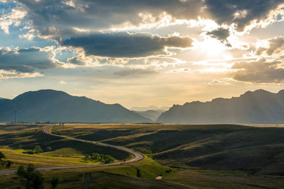 Scenic view of landscape against sky during sunset