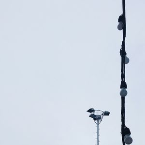 Low angle view of street light against clear sky