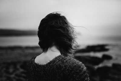 Rear view of woman at sea shore