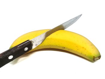 Close-up of banana against white background