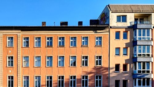 Low angle view of residential building against clear sky