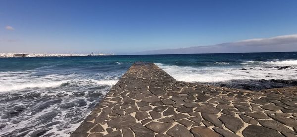 Scenic view of beach against sky