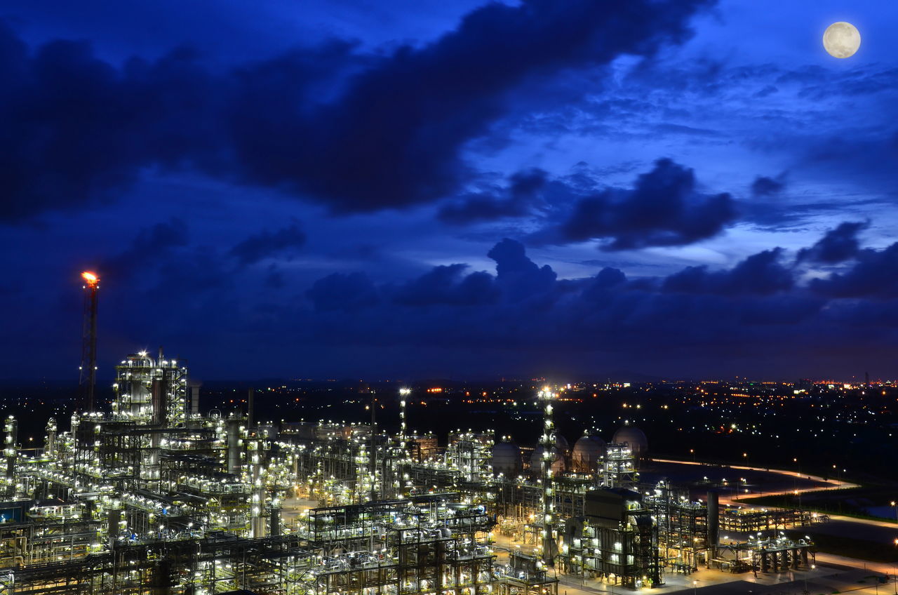 ILLUMINATED CITY AGAINST SKY AT NIGHT