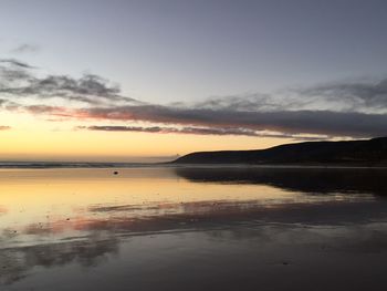 Scenic view of sea against sky during sunset