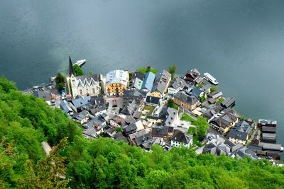 High angle view of townscape by lake