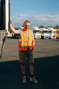 Rear view of man standing on road