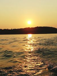 Scenic view of sea at sunset