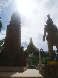 Statue of historic building against sky