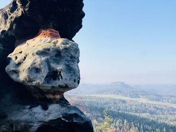 Scenic view of rocks against clear sky