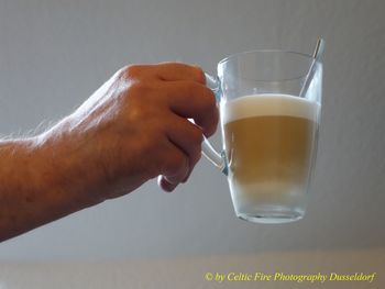 Close-up of hand holding drink