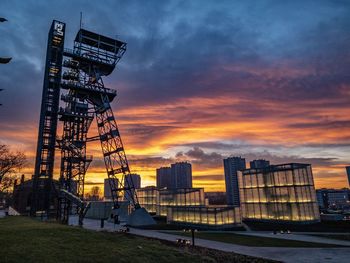 Low angle view of buildings against sky during sunset