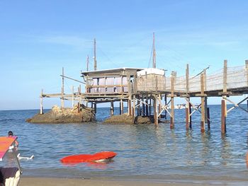 Pier over sea against sky